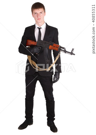 man in black suit and ak 47 man in black suit and ak 47 40855311