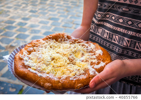 Langos is a Hungarian food speciality Langos is a Hungarian food speciality 40855766