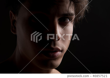 Youthful man is posing pensively 40857521