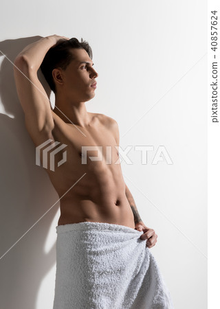 Pleasant gorgeous youthful man is showing naked body Pleasant gorgeous youthful man is showing naked body 40857624