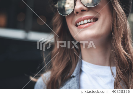 Cheerful young lady in trendy shades Cheerful young lady in trendy shades 40858336