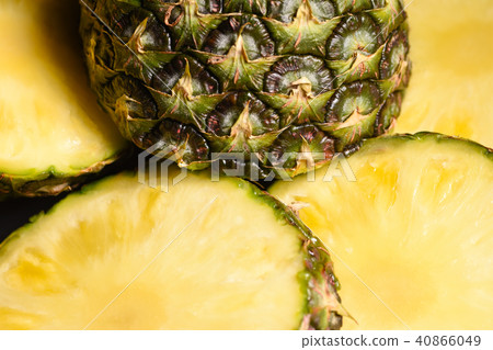 Close-up juicy cut pineapple on the kitchen table Close-up juicy cut pineapple on the kitchen table 40866049