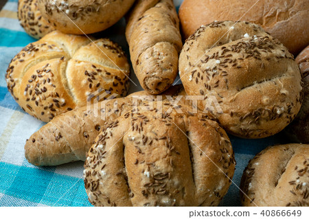 Heap of various bread rolls sprinkled with salt 40866649