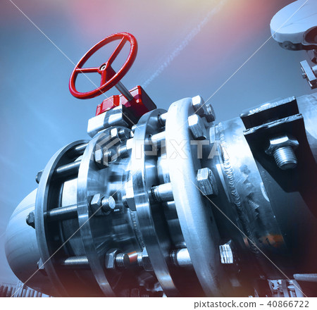 Steel pipelines and valves against blue sky 40866722