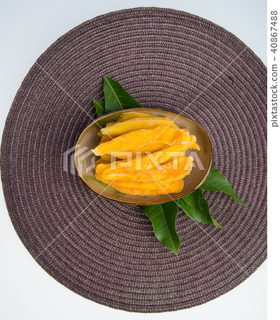 Dried Mango or Dried Mango slices on a background. Dried Mango or Dried Mango slices on a background. 40867488