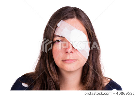 Portrait of woman wearing eye patch as protection after injury Portrait of woman wearing eye patch as protection after injury 40869555