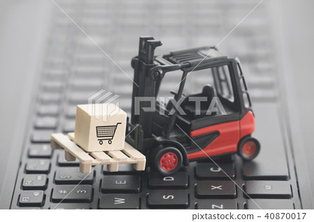 Forklift with shopping cart graphic on keyboard Forklift with shopping cart graphic on keyboard 40870017