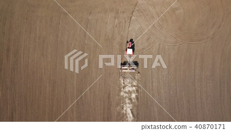 Aerial view tractor in the field, spring works 40870171