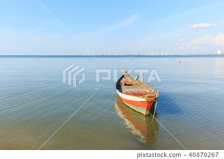 old wood fishing boat at anchor in sea old wood fishing boat at anchor in sea 40870267