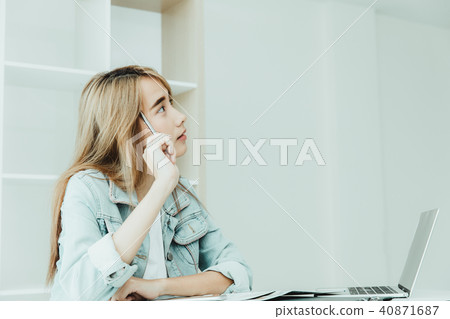 Asian young employee thinking or inattentive Asian young employee thinking or inattentive 40871687