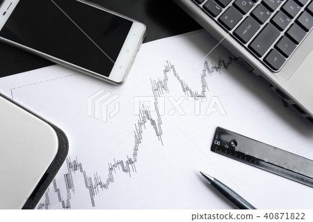 Chart on paper with office supplies 40871822