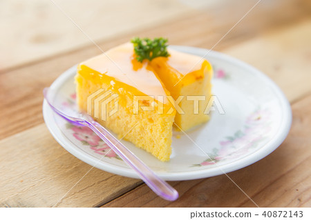 Orange cake on wooden table background Orange cake on wooden table background 40872143