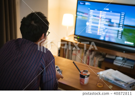 A young Japanese men engrossing in video games 40872811