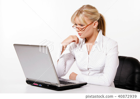 Beautiful young woman working with laptop Beautiful young woman working with laptop 40872939