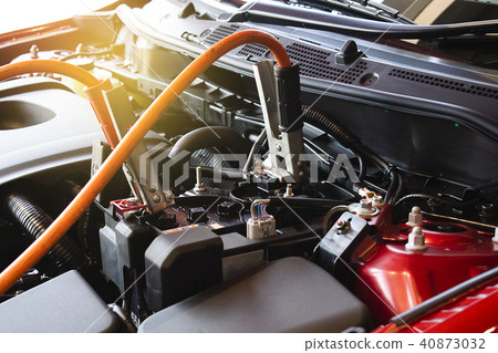 Charging battery car on blurry background. Charging battery car on blurry background. 40873032