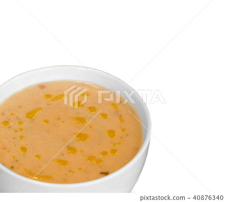 Plate of soup on white background 40876340