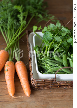 Carrots and watercress and snap peas Carrots and watercress and snap peas 40883571
