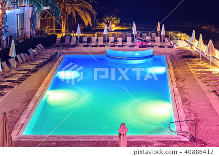Night view from top to hotel pool with colorful 40886412