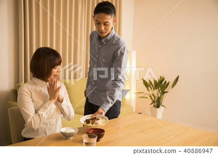 Husband giving dinner to his wife 40886947