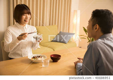 Husband giving dinner to his wife 40886951