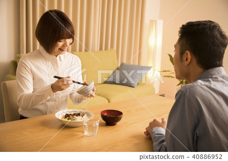Husband giving dinner to his wife 40886952