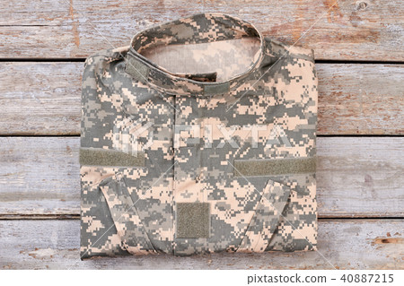 Folded camouflage military jacket. Folded camouflage military jacket. 40887215