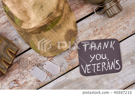 Military khaki cap and dog tags, top view. 40887218