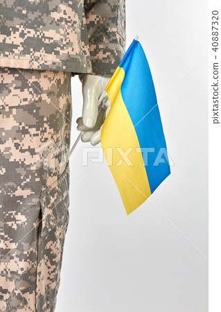 Mannequin hand holding ukrainian flag. Mannequin hand holding ukrainian flag. 40887320