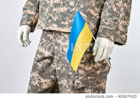 Mannequin holds ukrainian flag. 40887420