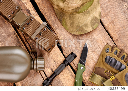 Set of military clothes and equipment on wooden background. 40888499