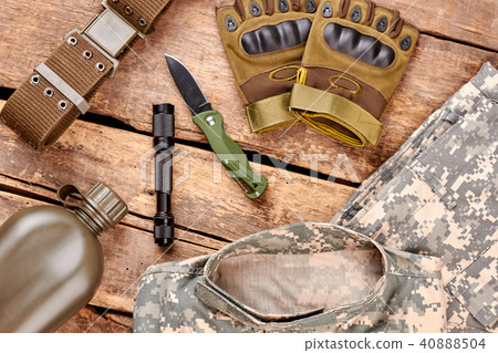 Set of military equipment on wooden table. Set of military equipment on wooden table. 40888504