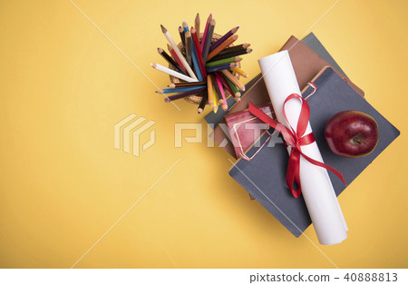 School supplies and graduation certificate on wood 40888813