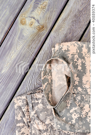 Set of camoulfage military clothes on wood. Set of camoulfage military clothes on wood. 40889374