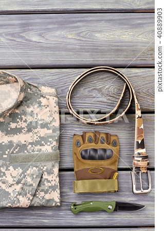 Twisted belt, glove, pocket knife and camouflage jacket. Twisted belt, glove, pocket knife and camouflage jacket. 40889903