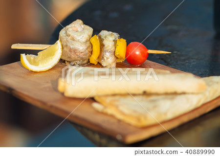Fish barbecue with cherry tomato and lemon 40889990