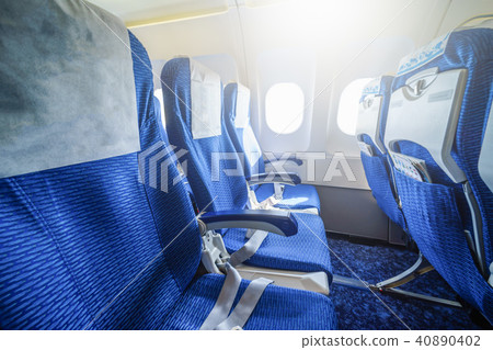 Empty seats interior of an airplane at daytime. 40890402