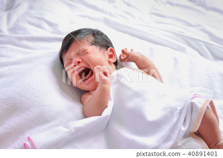 Newborn Concept. Newborn babies are sleeping in a bed. The baby 40891401