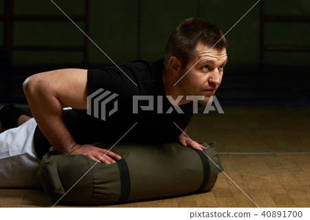 One man doing push ups One man doing push ups 40891700