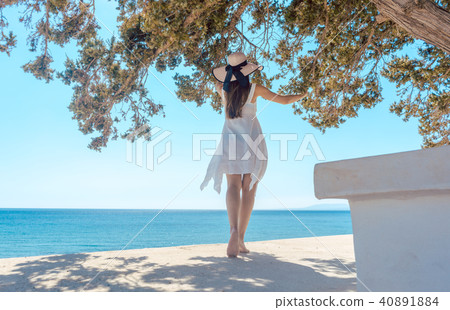 Woman in a greek vacation looking at the ocean Woman in a greek vacation looking at the ocean 40891884