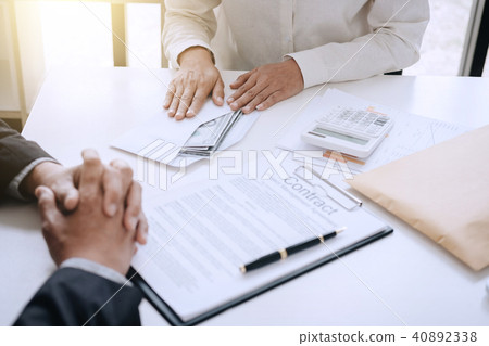 Bribery and corruption concept, bribe in the form of dollar bill Bribery and corruption concept, bribe in the form of dollar bill 40892338