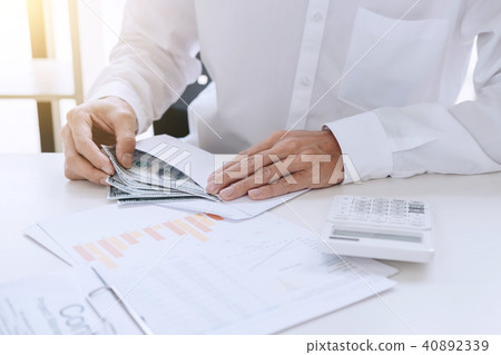 Money in human hands form of dollar bills, Businessman is counti 40892339