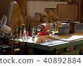 Carpenter tools on wooden table with sawdust 40892884