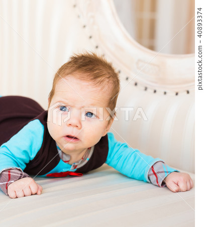 Cute newborn baby boy in sunny room 40893374
