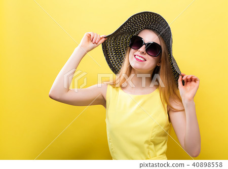 Happy young woman wearing a hat Happy young woman wearing a hat 40898558
