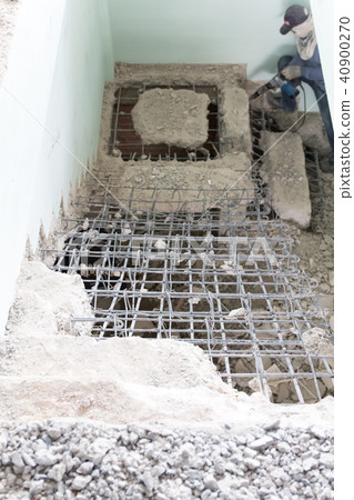 cement stairs with jackhammer 40900270