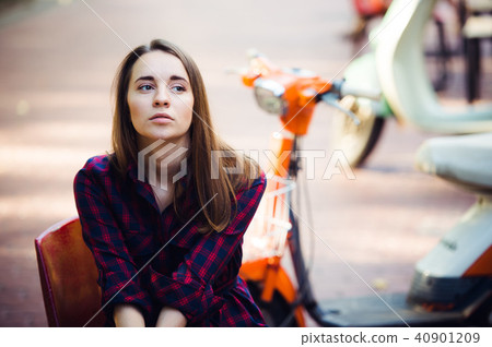 Portrait of pretty smiling girl on scooter Portrait of pretty smiling girl on scooter 40901209