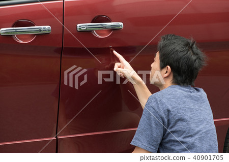 Car dent by door punch 40901705