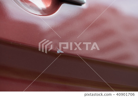 Car dent by door punch 40901706
