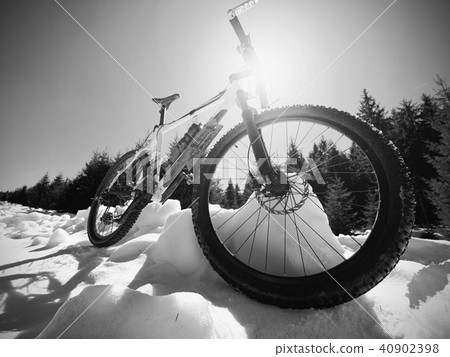 Wide view photo of mountain bike in deep snow. Wide view photo of mountain bike in deep snow. 40902398