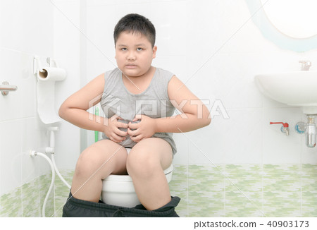 fat boy suffer stomach and sit in toilet 40903173